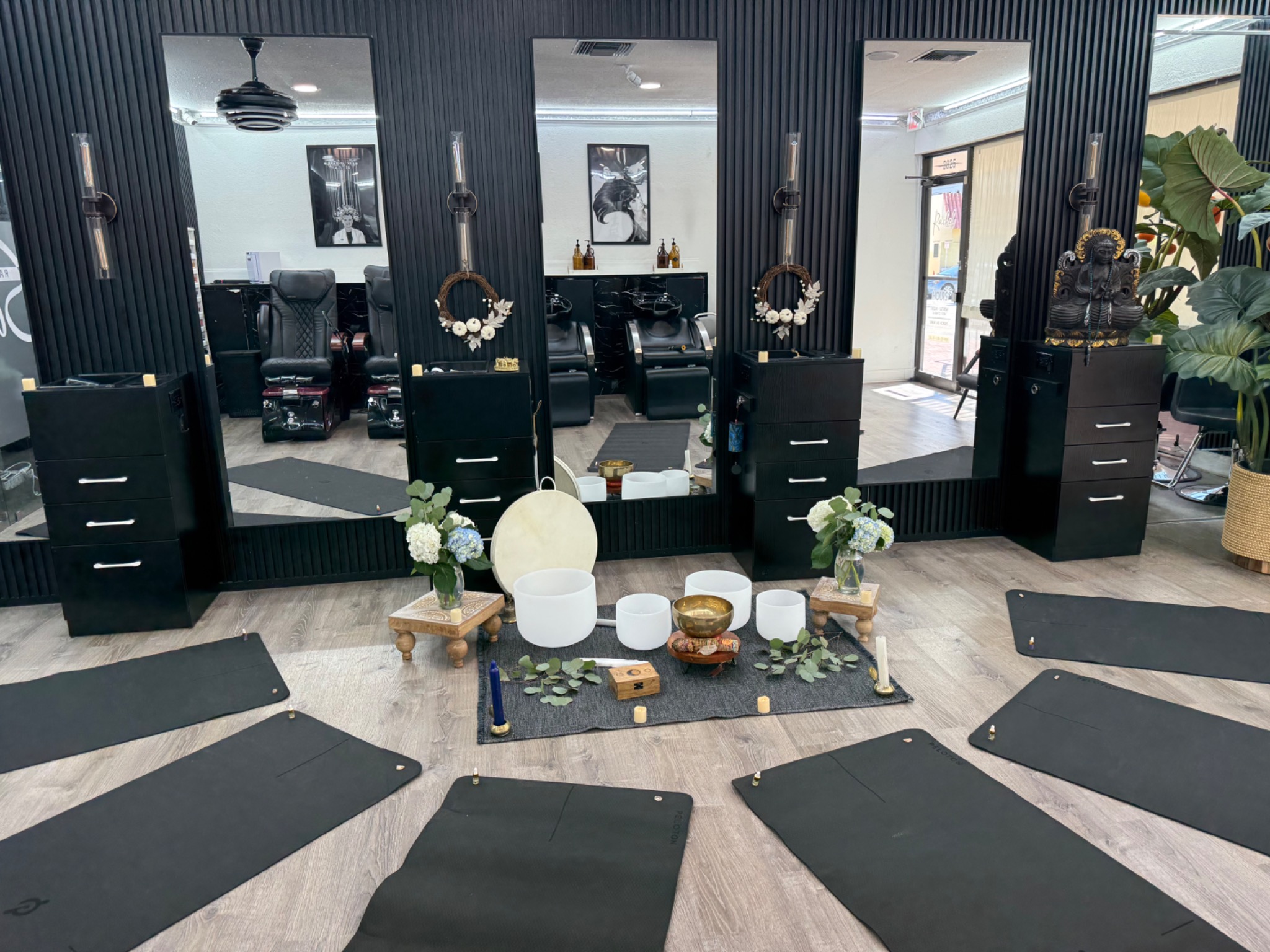 EverEssentia Circle setting with yoga mats, singing bowls, flowers, and candles